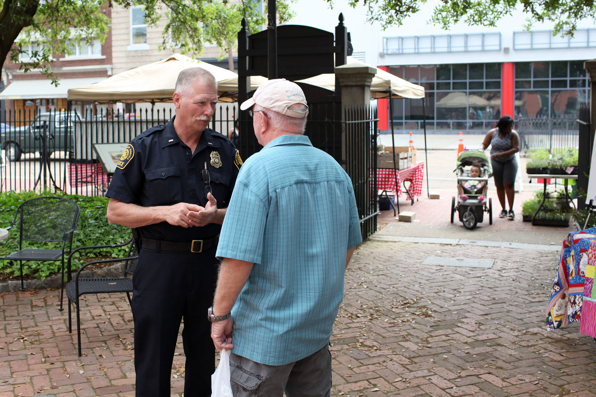 A police officer and citizen have a friendly conversation